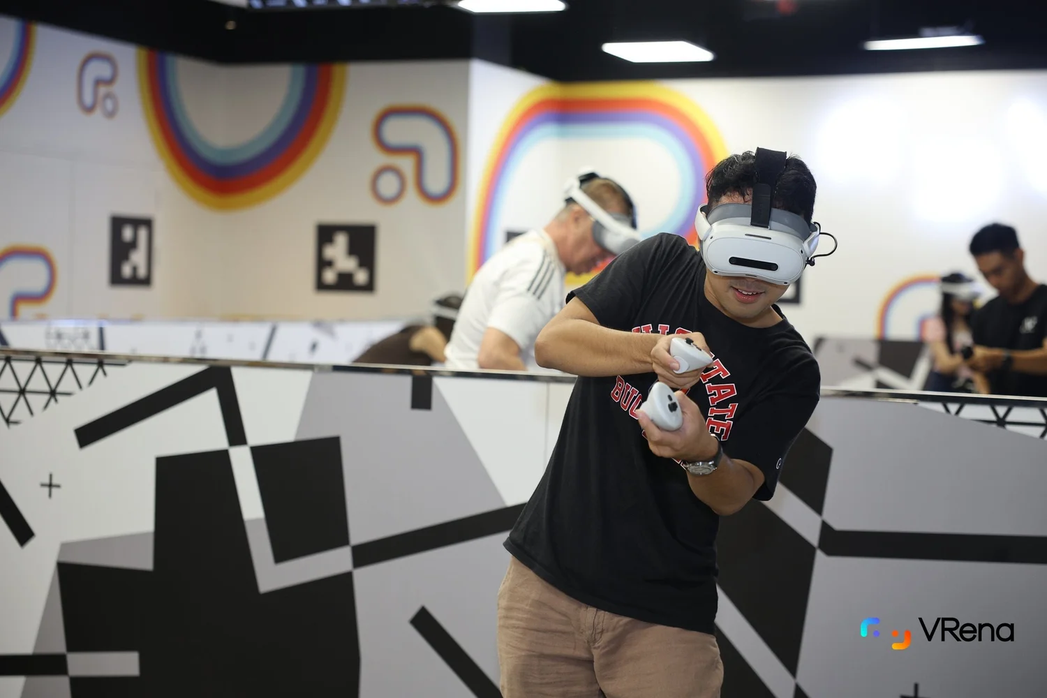 Players using VR controllers in the open play area
