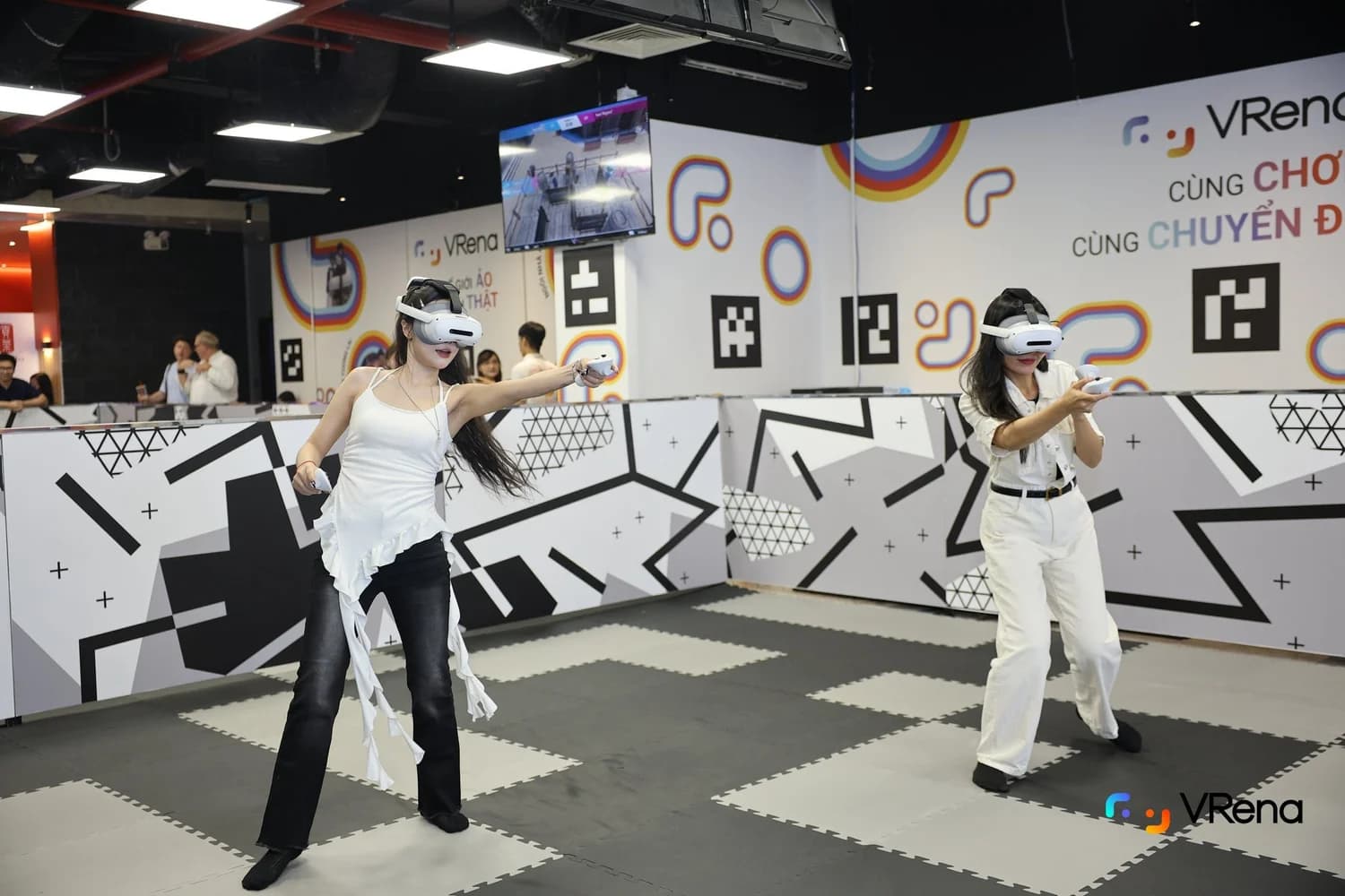 Two guests moving through a shared VR mission